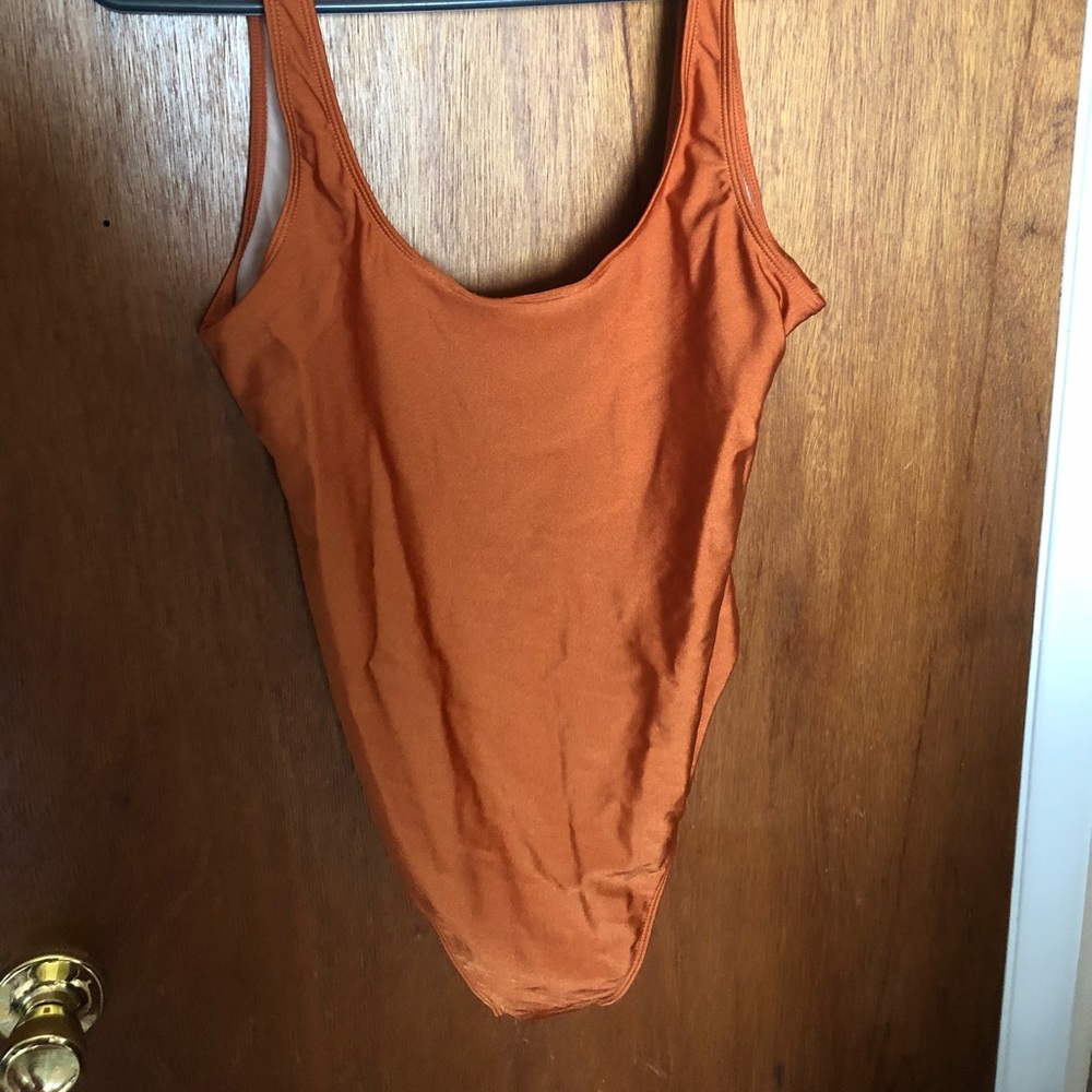 Brand new burnt orange one piece bathing suit